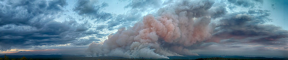 Looking East from below Turkey Butte Lookout the Slide Fire mixes with clouds at dusk