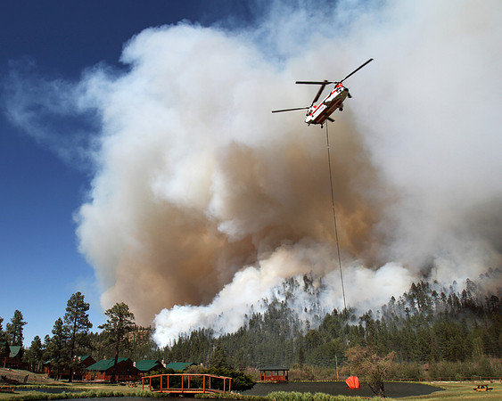 A Chinook dips his 2500 gallon bucket