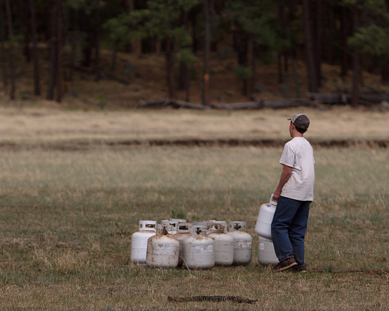 Boyscouts from Brentwood move propane bottles to meadow before evacuating