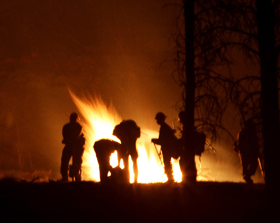 Hotshots rest a moment after completing a burnout